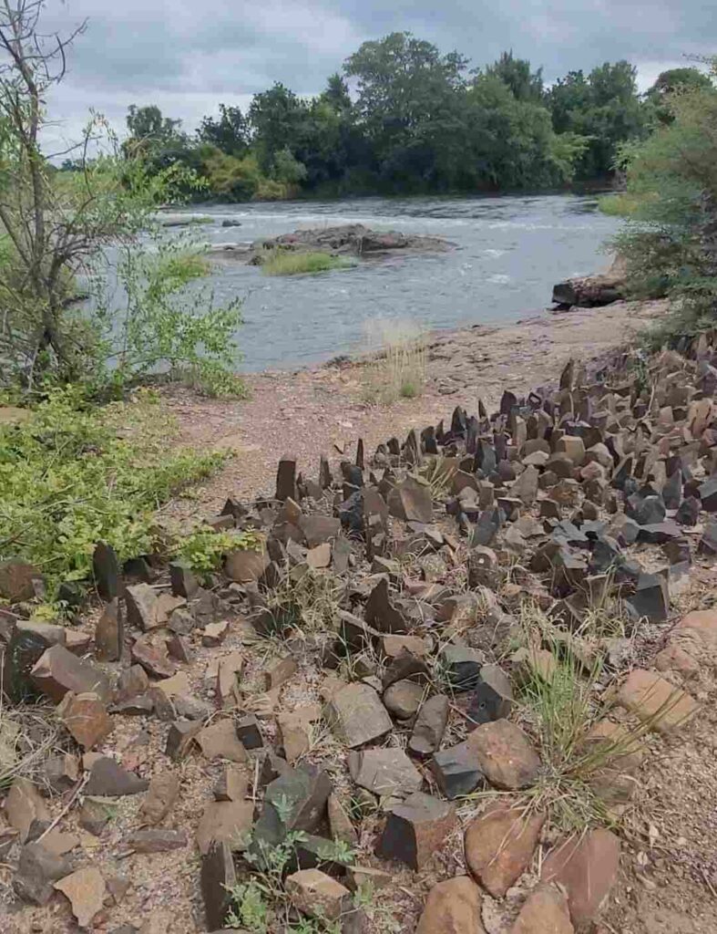 Rocks along the Zambezi River to stop hippos from coming up onto the land