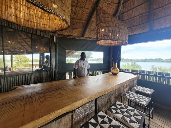 Bar area of Victoria Falls River Lodge with a view overlooking the Zambezi River