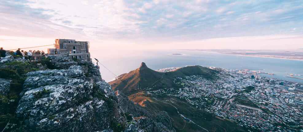 View from the top of Table Mountain overlooking Lions Head and the city and the cable car station.