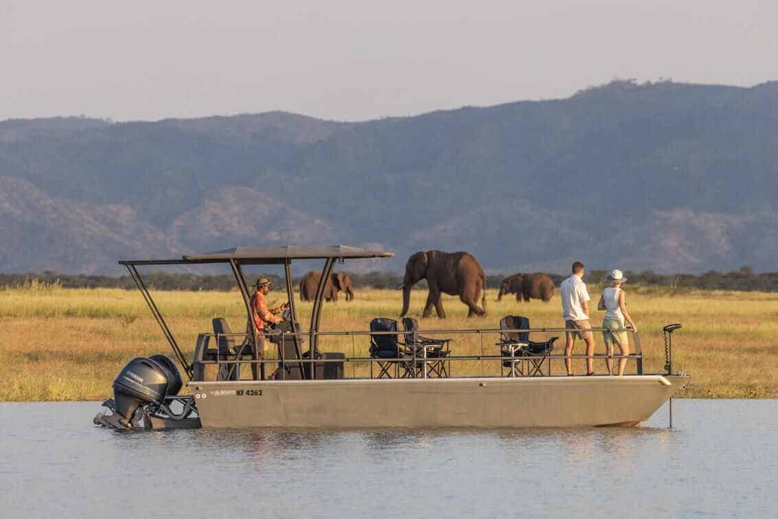 Boating safari at Fothergill camp in Lake Kariba with elephants in the background
