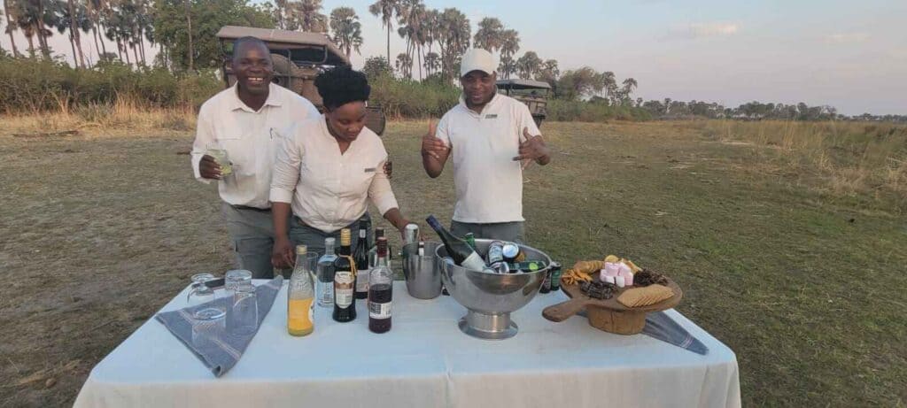 Sundowner drinks in Botswana set out on a game with an ice bucket and snacks