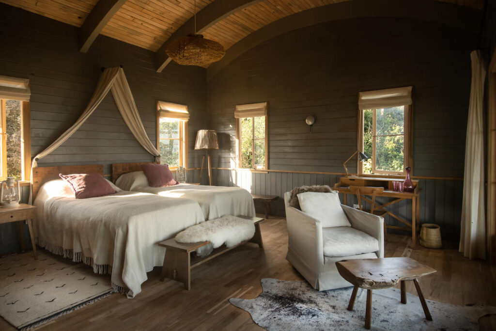 Interior of a twin room - wooden chalet at Entamanu Ngorongoro Lodge. 